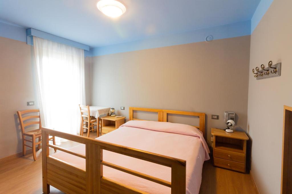 Postel nebo postele na pokoji v ubytování Albergo Speranza