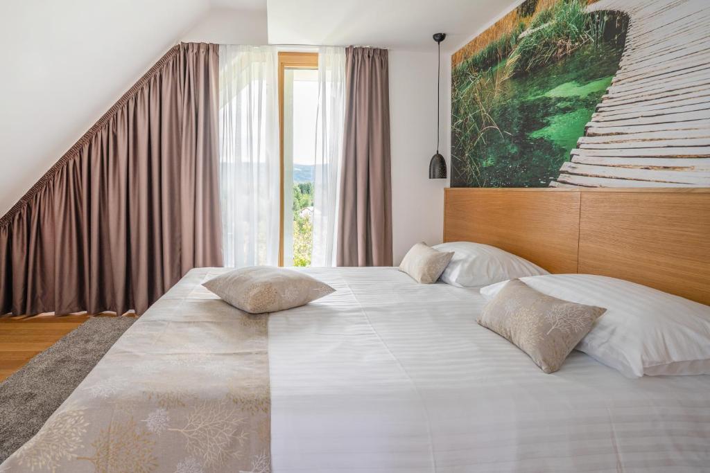 Posteľ alebo postele v izbe v ubytovaní Hotel Palcich Plitvice