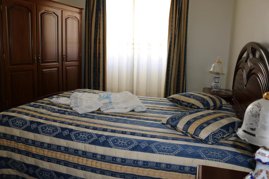 Postel nebo postele na pokoji v ubytování Casa Buzina