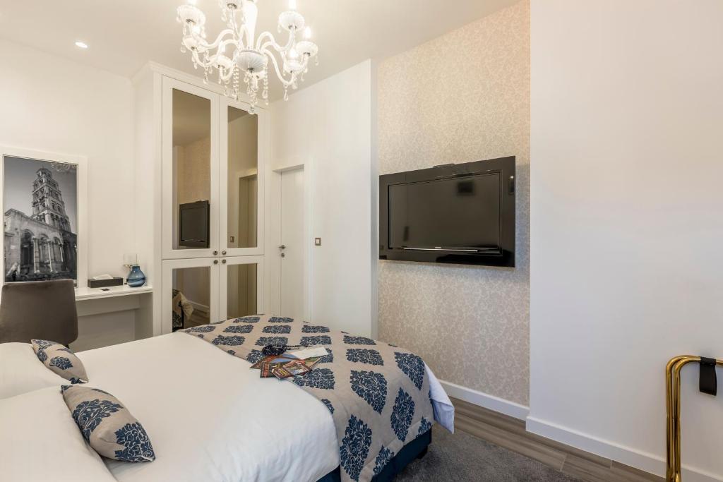Postel nebo postele na pokoji v ubytování Elixir luxury rooms