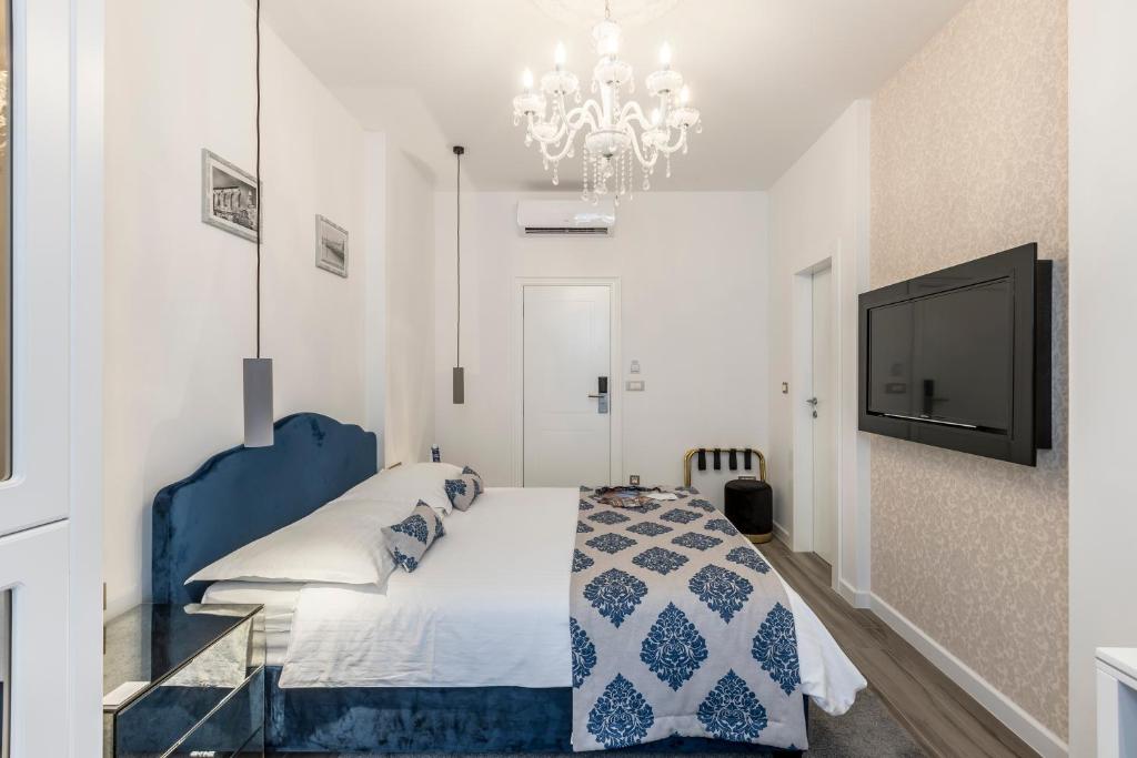 Postel nebo postele na pokoji v ubytování Elixir luxury rooms