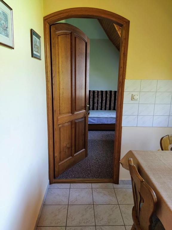 A bed or beds in a room at Bodó Ház