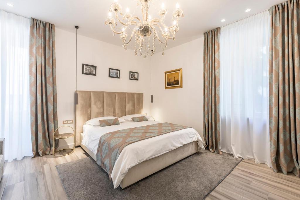 Postel nebo postele na pokoji v ubytování Elixir luxury rooms