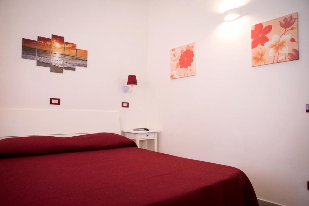 Postel nebo postele na pokoji v ubytování B&B La Pineta