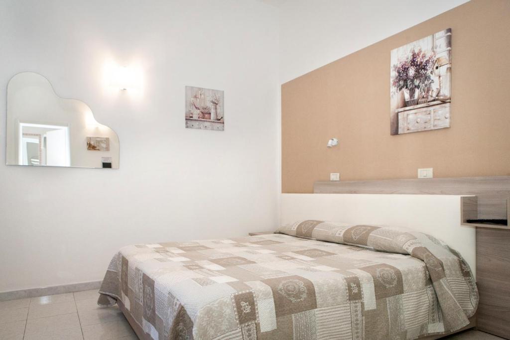 Postel nebo postele na pokoji v ubytování B&B La Pineta