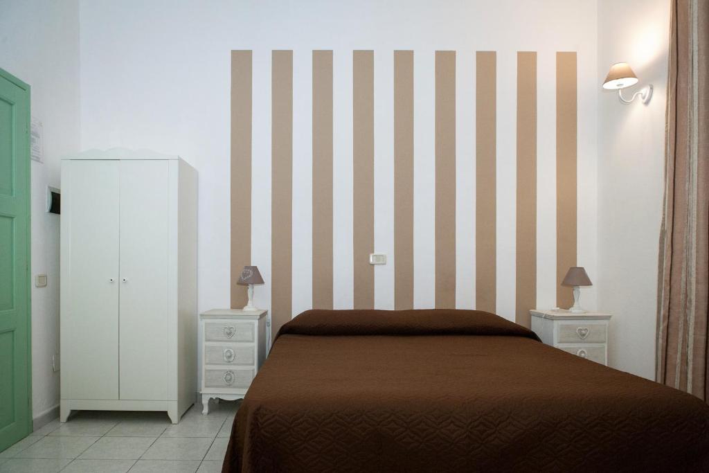 Postel nebo postele na pokoji v ubytování B&B La Pineta