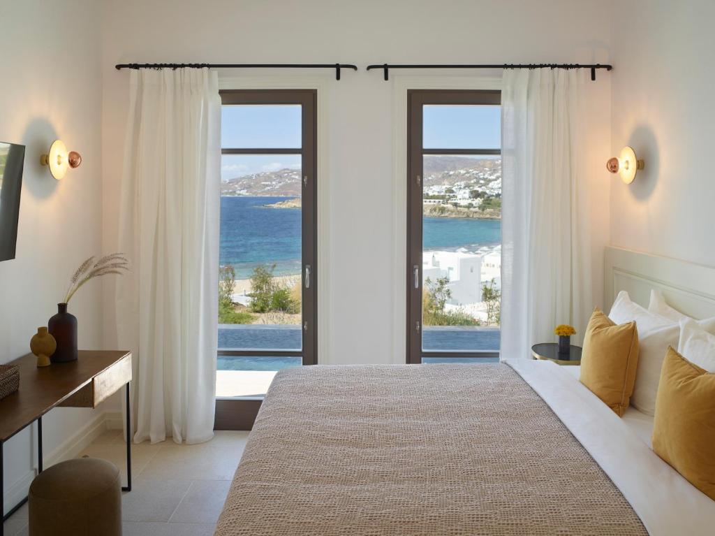 Postel nebo postele na pokoji v ubytování Bonzoe Suites & Villas