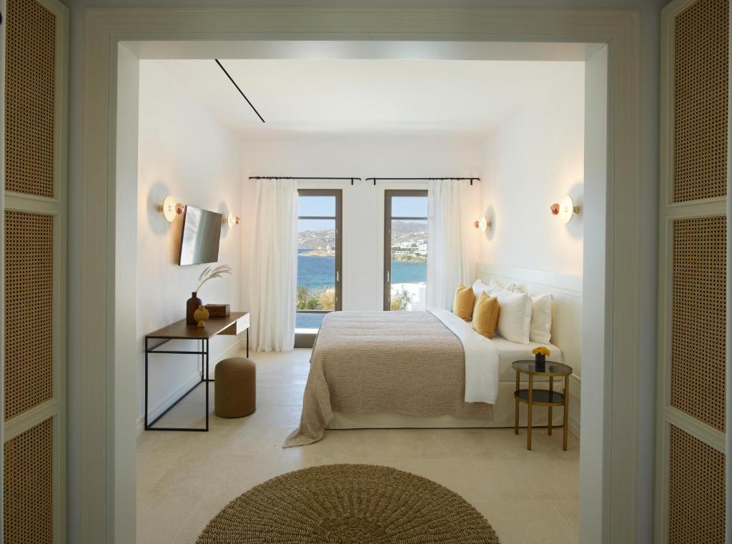 Postel nebo postele na pokoji v ubytování Bonzoe Suites & Villas
