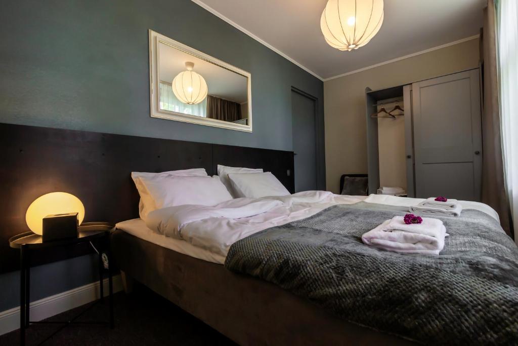 Postel nebo postele na pokoji v ubytování Hotel Marino