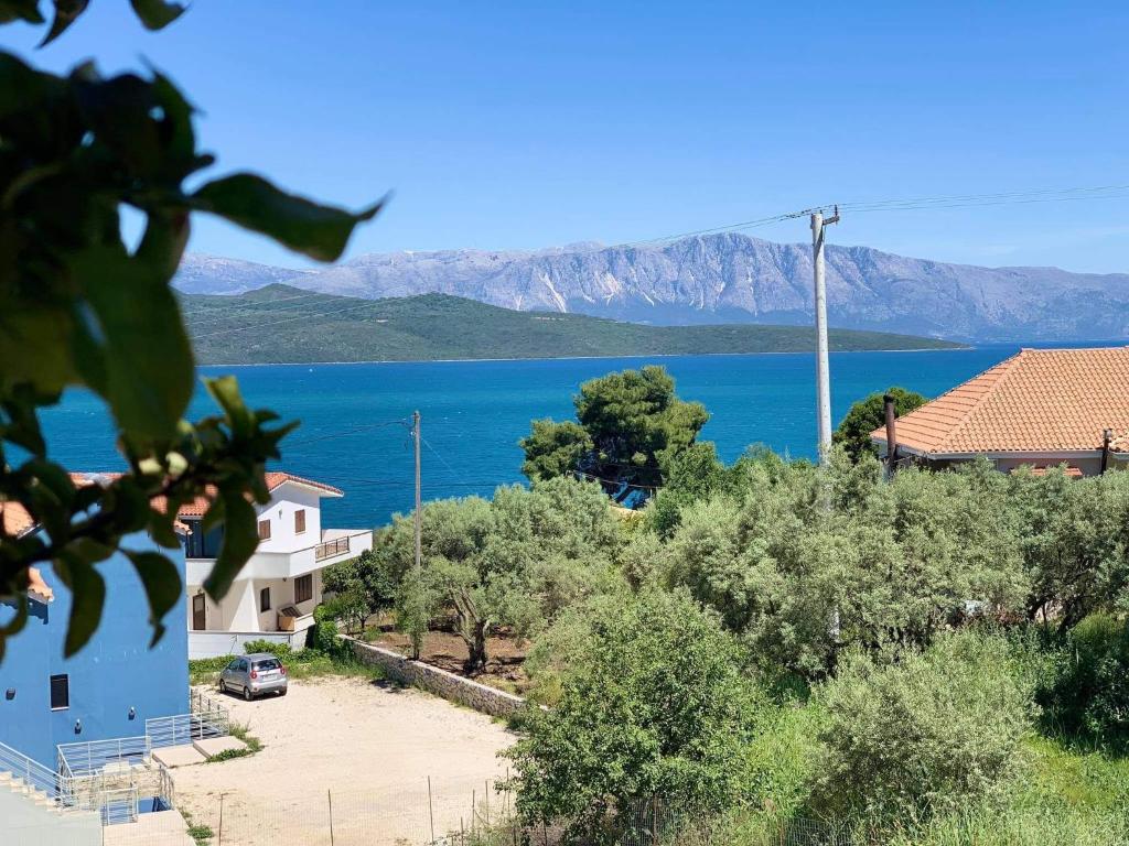 a view of a body of water with a house at Villa theosis in Nikiana