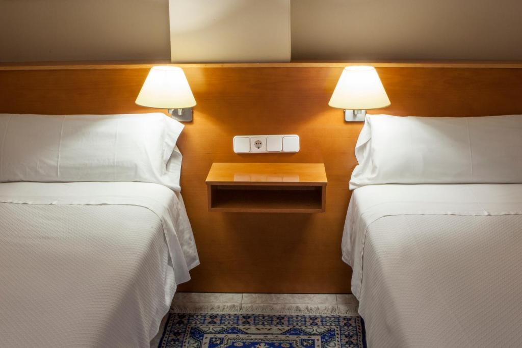 Postel nebo postele na pokoji v ubytování PARK SEDO Aparthotel