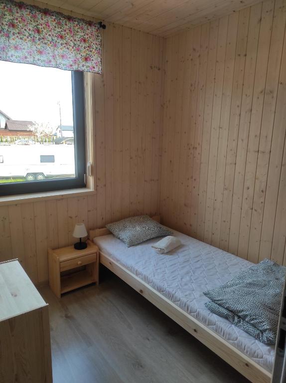 Postel nebo postele na pokoji v ubytování Vela Sarbinowo