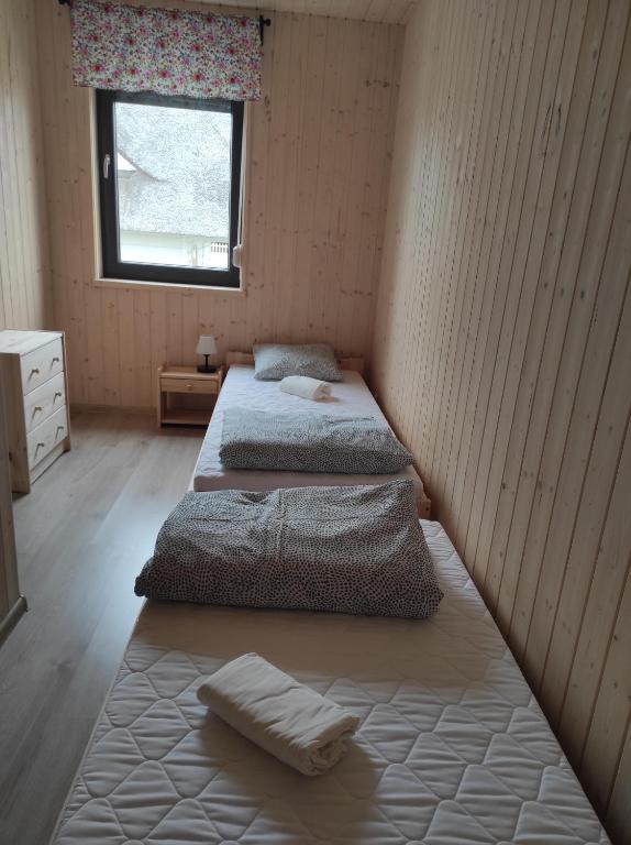 Postel nebo postele na pokoji v ubytování Vela Sarbinowo