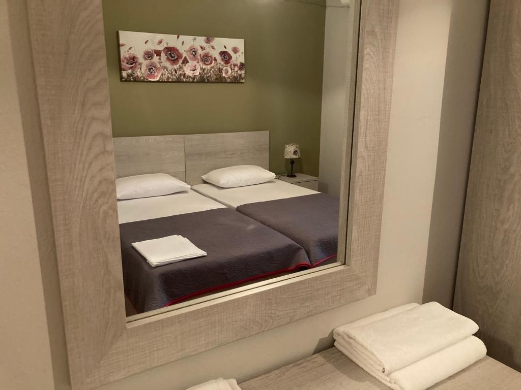 Postel nebo postele na pokoji v ubytování Hotel Medousa