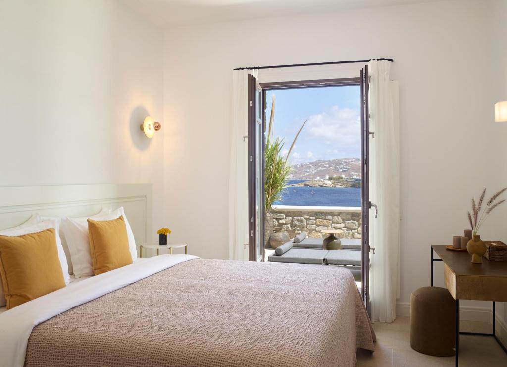 Postel nebo postele na pokoji v ubytování Bonzoe Suites & Villas