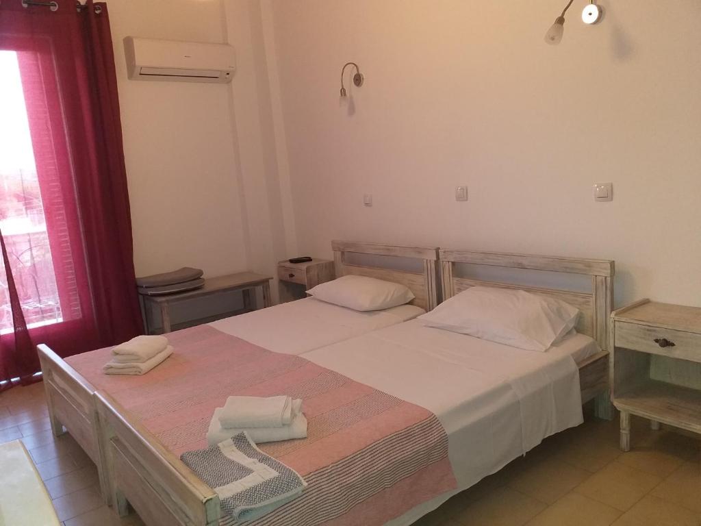 Postel nebo postele na pokoji v ubytování Ψιλή Άμμος