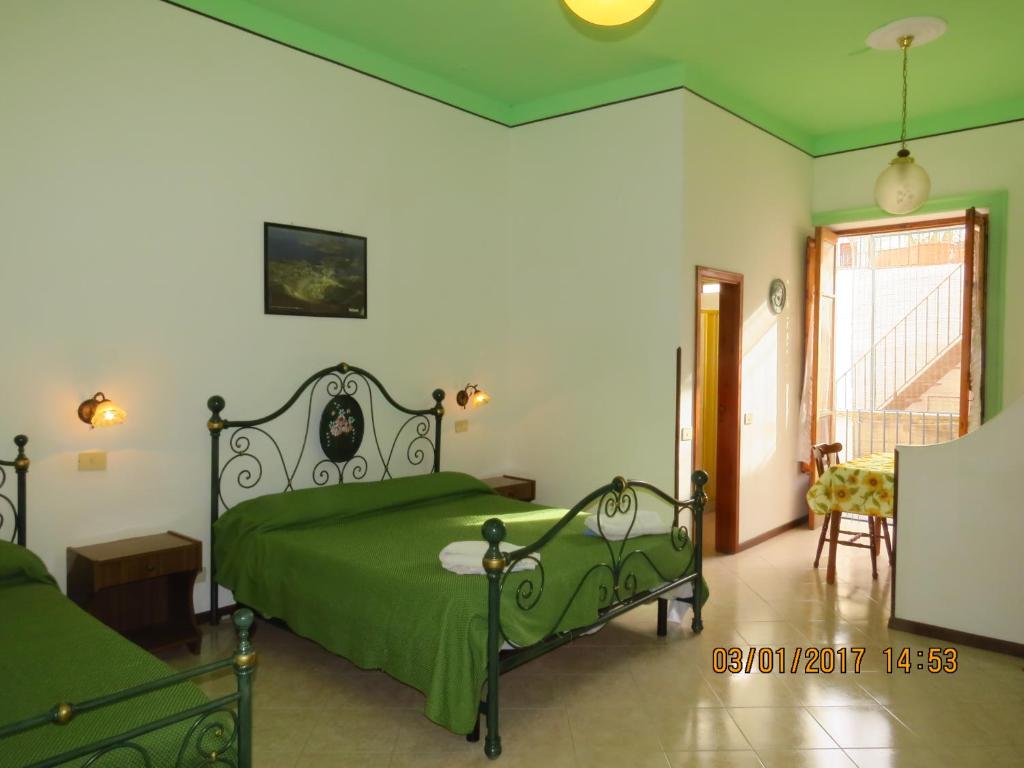 Postel nebo postele na pokoji v ubytování Casa Vittorio B&b