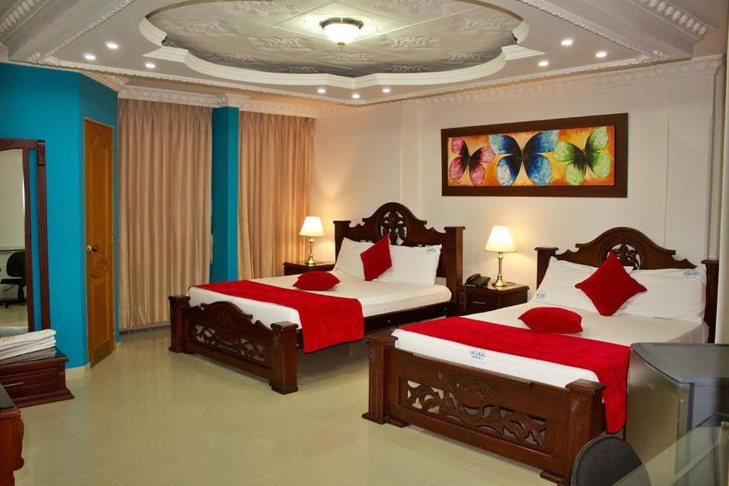 En eller flere senger på et rom på Hotel Vans Valledupar