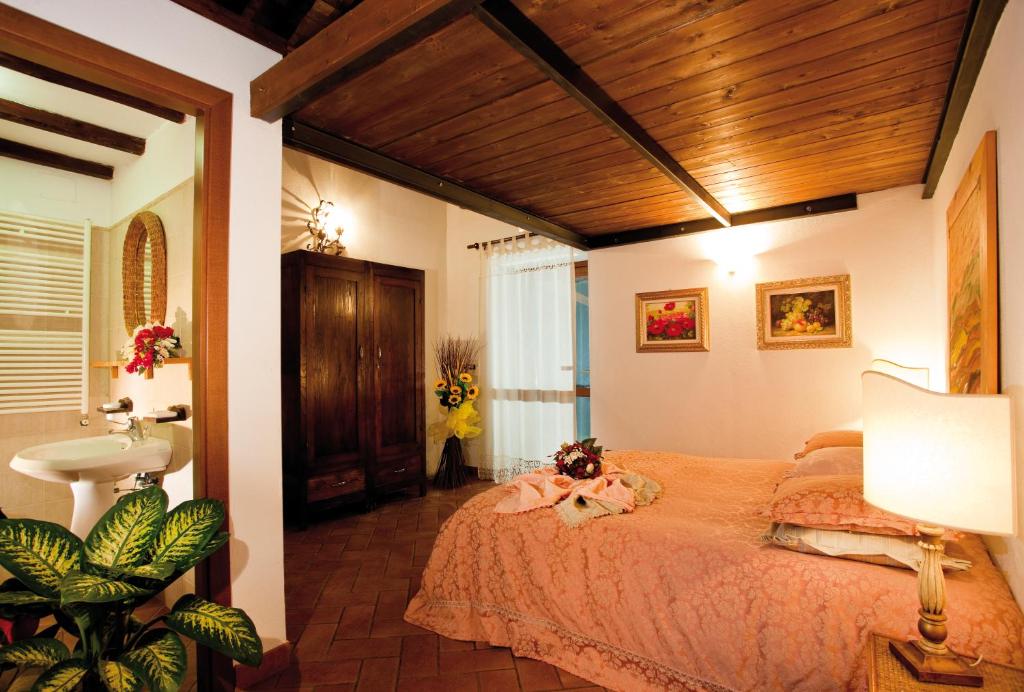 Säng eller sängar i ett rum på Agriturismo Colle Tocci