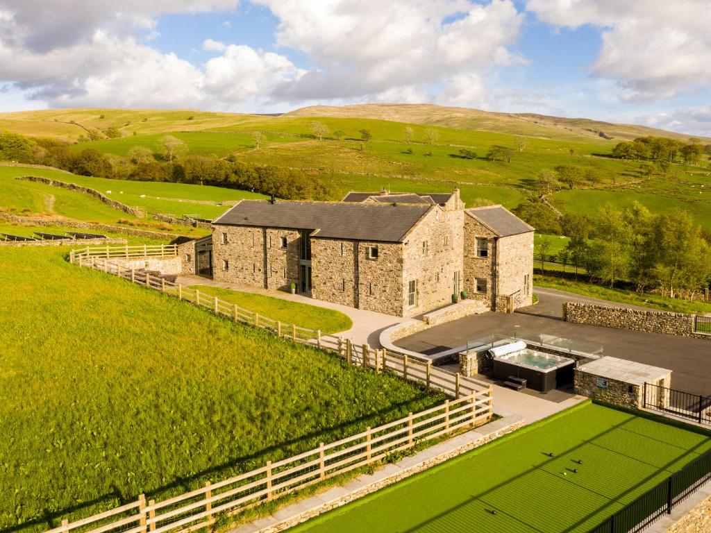 an aerial view of a building in a field at High View Barn in Carnforth