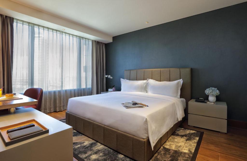 Postel nebo postele na pokoji v ubytování Makati Diamond Residences