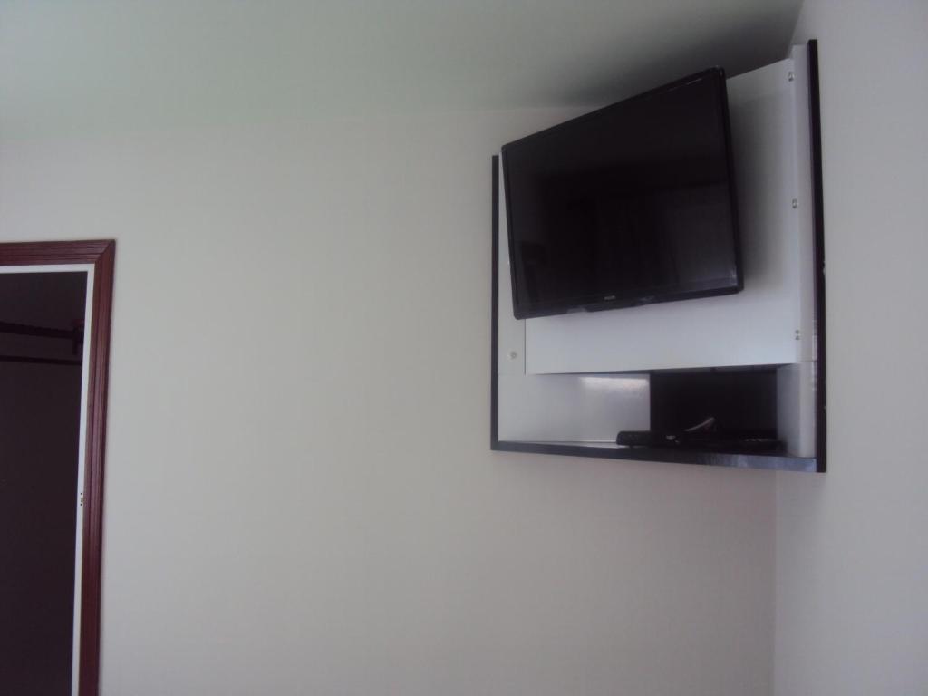 TV a/nebo společenská místnost v ubytování Sweet Rio Residence Taquara