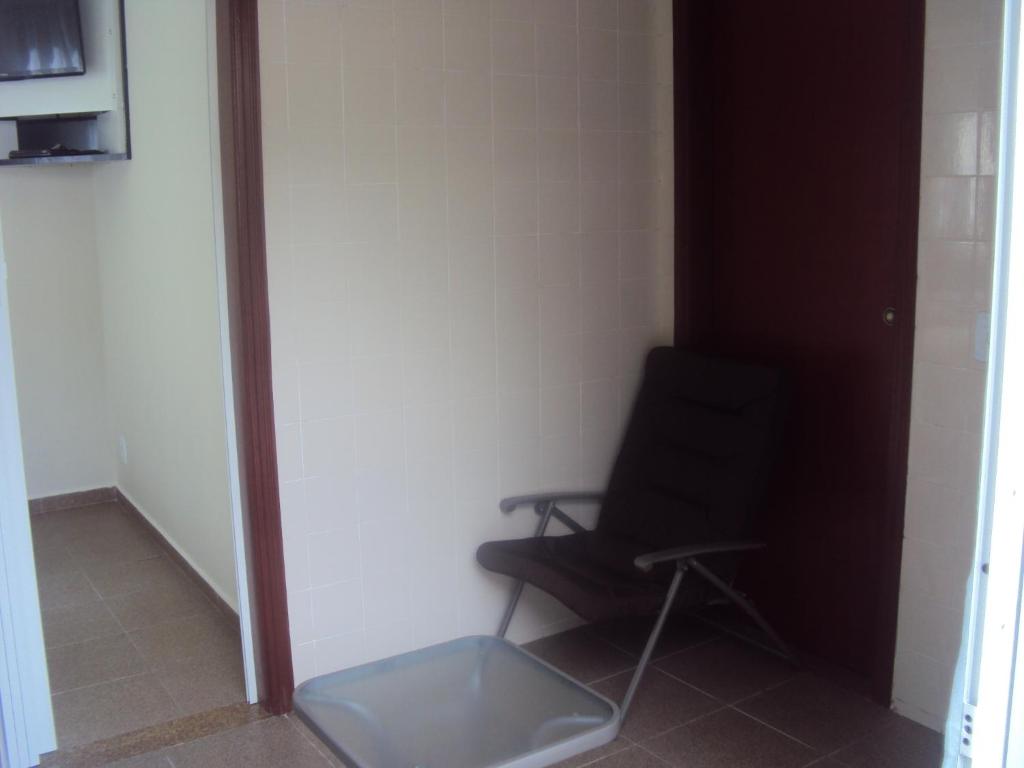 TV a/nebo společenská místnost v ubytování Sweet Rio Residence Taquara