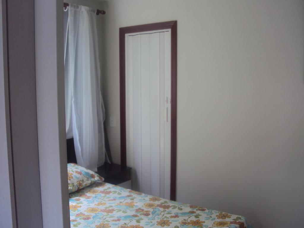 Postel nebo postele na pokoji v ubytování Sweet Rio Residence Taquara