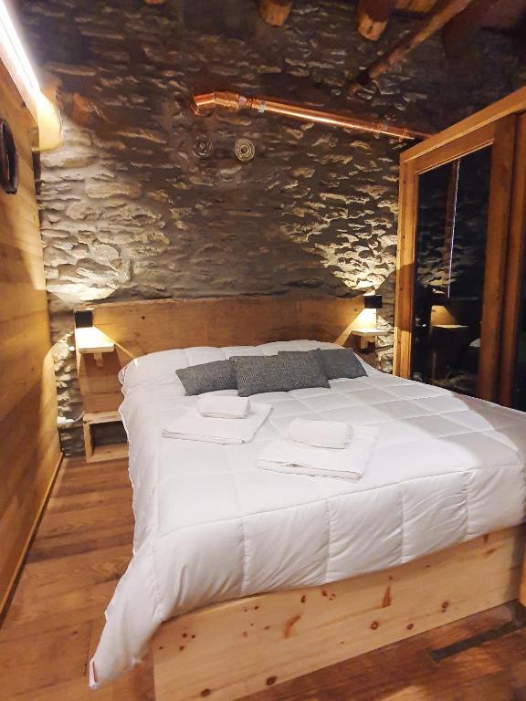 Postel nebo postele na pokoji v ubytování Brieis Relais Alpino