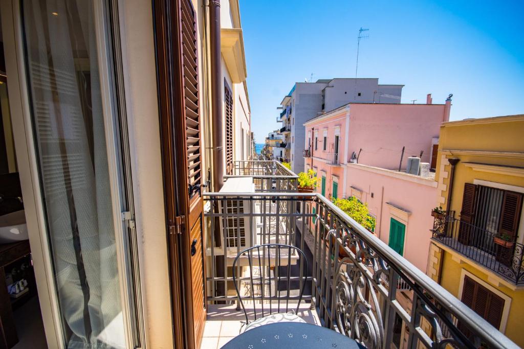 an apartment balcony with a view of a city at Sogno D'Epoca 1822 in Monopoli