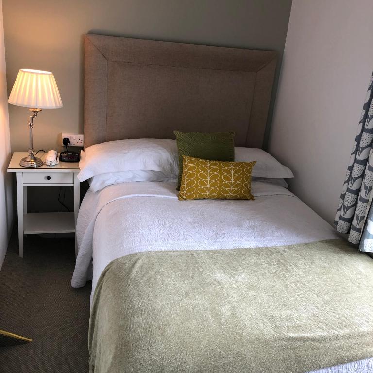 Postel nebo postele na pokoji v ubytování Petra House B&B