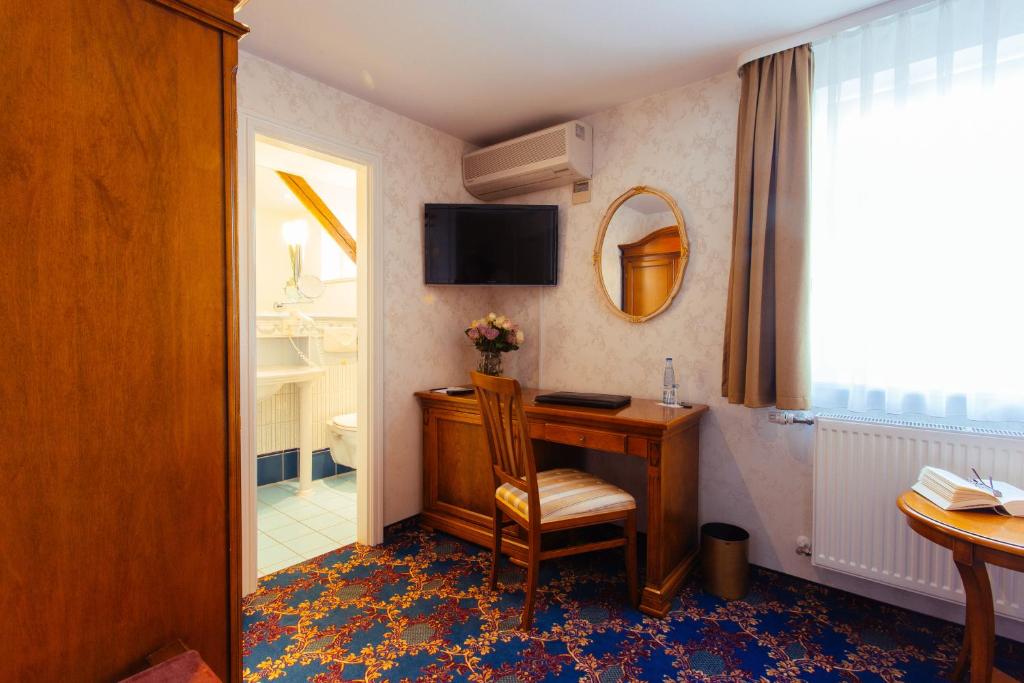 TV a/nebo společenská místnost v ubytování Boutiquehotel Schloßpalais