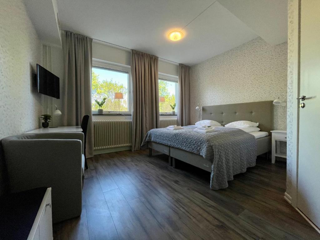 Postel nebo postele na pokoji v ubytování Hotell Luspen