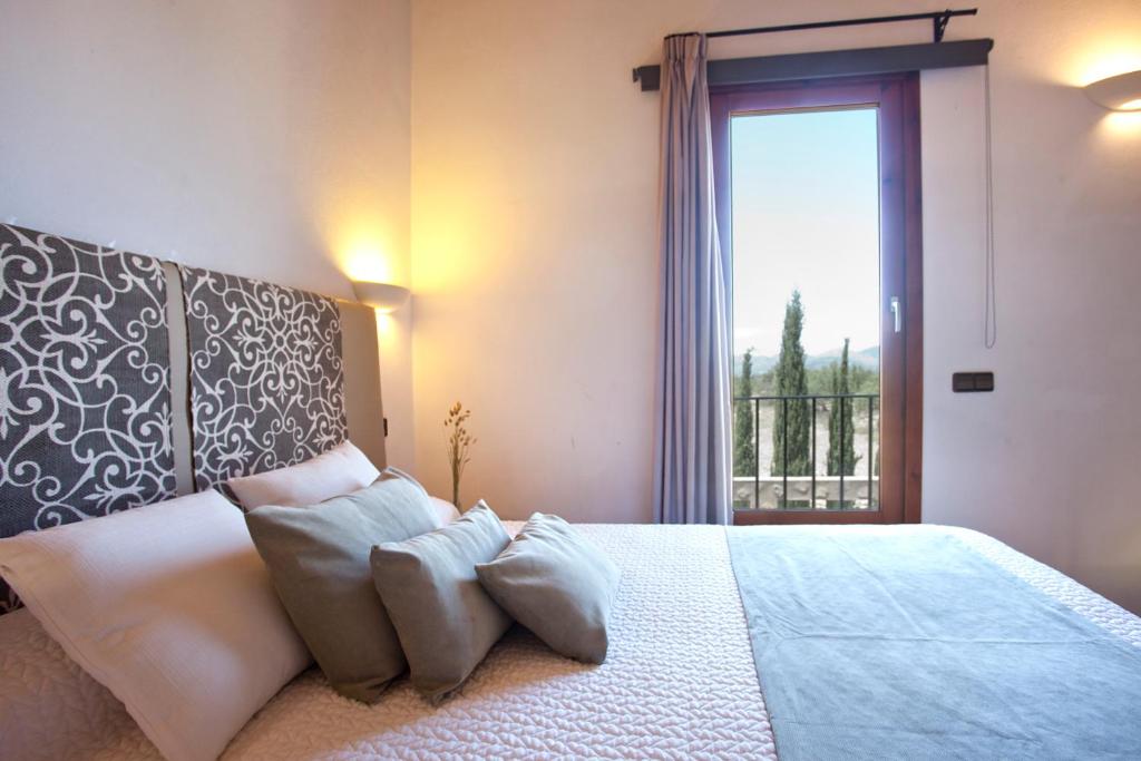 A bed or beds in a room at S'Hort de Son Caulelles - Adults Only