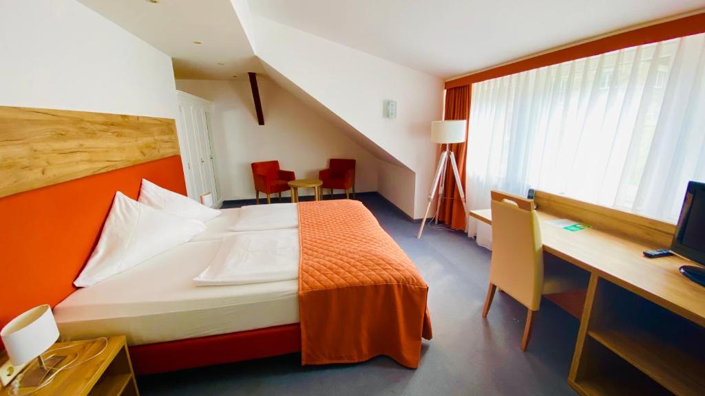 Postel nebo postele na pokoji v ubytování Hotel Erbgericht