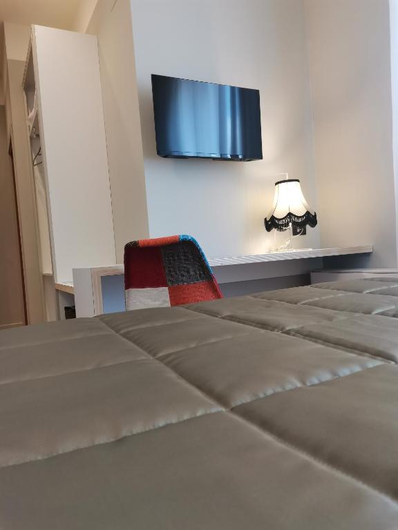 Postel nebo postele na pokoji v ubytování Hotel Moderno