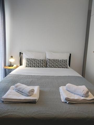 A bed or beds in a room at Precious Diamond with view - parking place and superfast WiFi