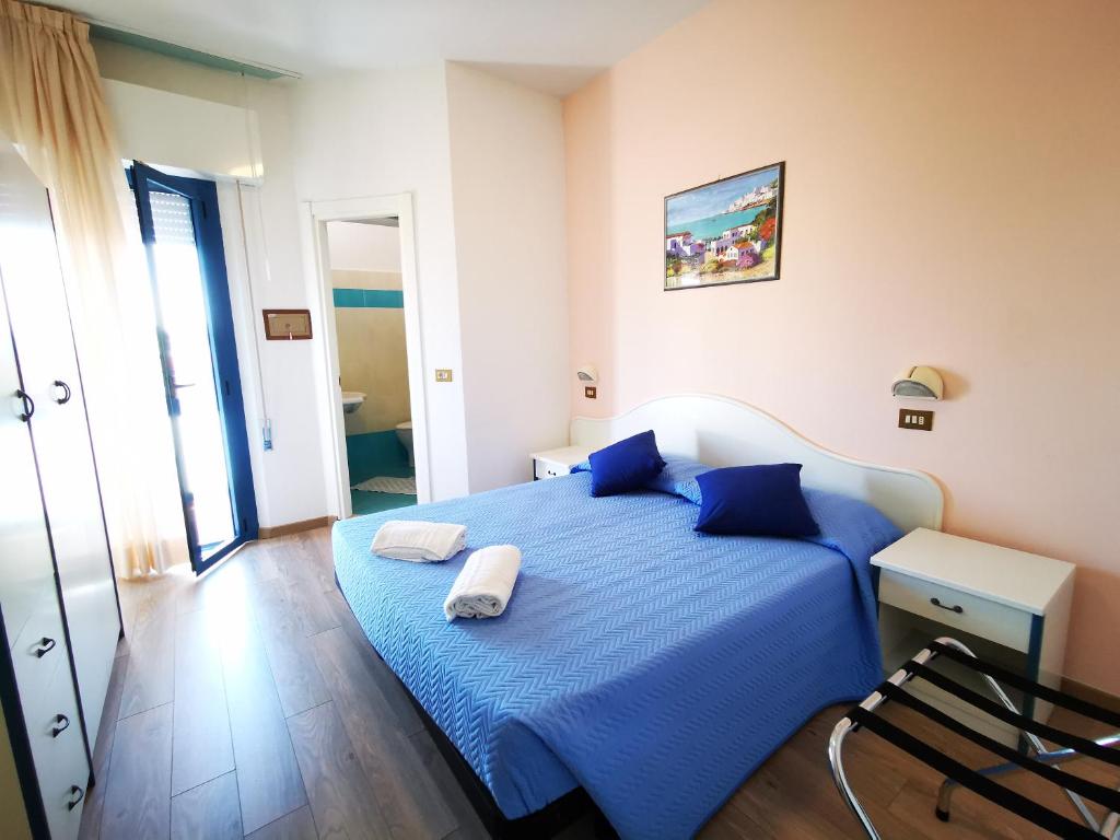 Postel nebo postele na pokoji v ubytování Hotel Tivoli