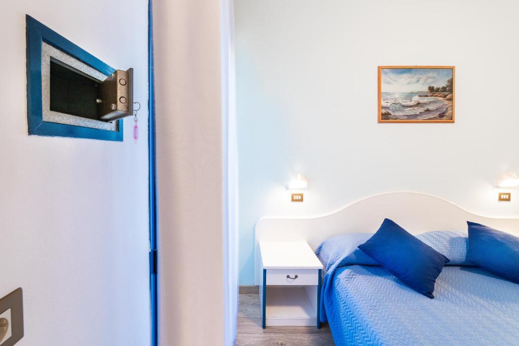 Postel nebo postele na pokoji v ubytování Hotel Tivoli
