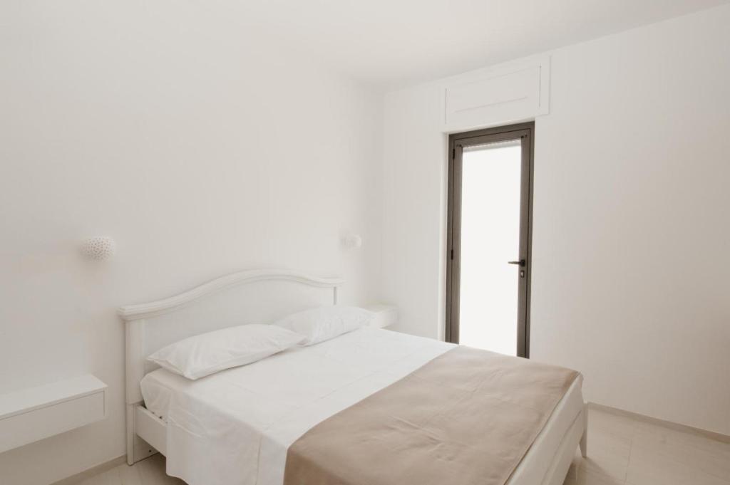 Łóżko lub łóżka w pokoju w obiekcie B&B Castello Otranto