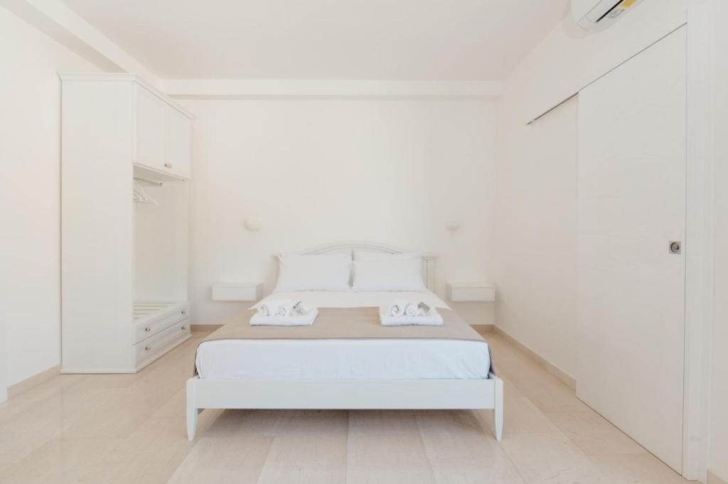 Łóżko lub łóżka w pokoju w obiekcie B&B Castello Otranto