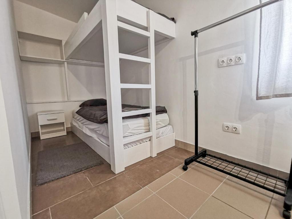 Postel nebo postele na pokoji v ubytování Greenfield Apartman