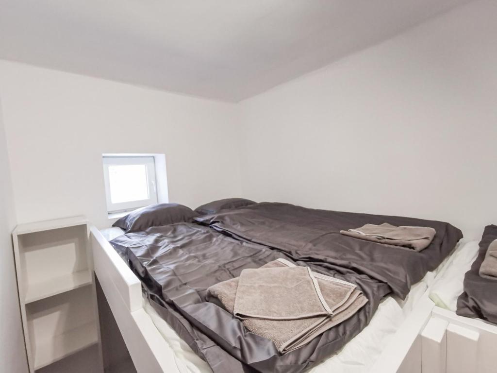 Postel nebo postele na pokoji v ubytování Greenfield Apartman