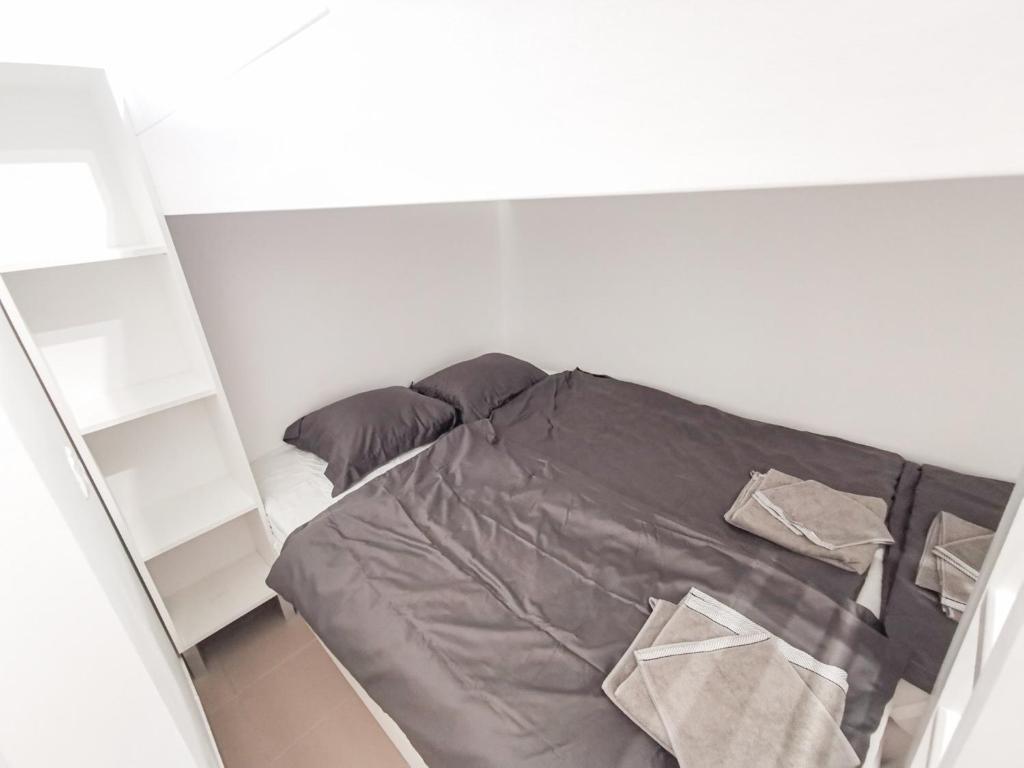 Postel nebo postele na pokoji v ubytování Greenfield Apartman