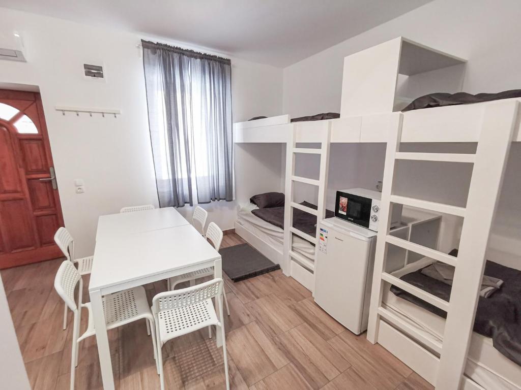 Postel nebo postele na pokoji v ubytování Greenfield Apartman