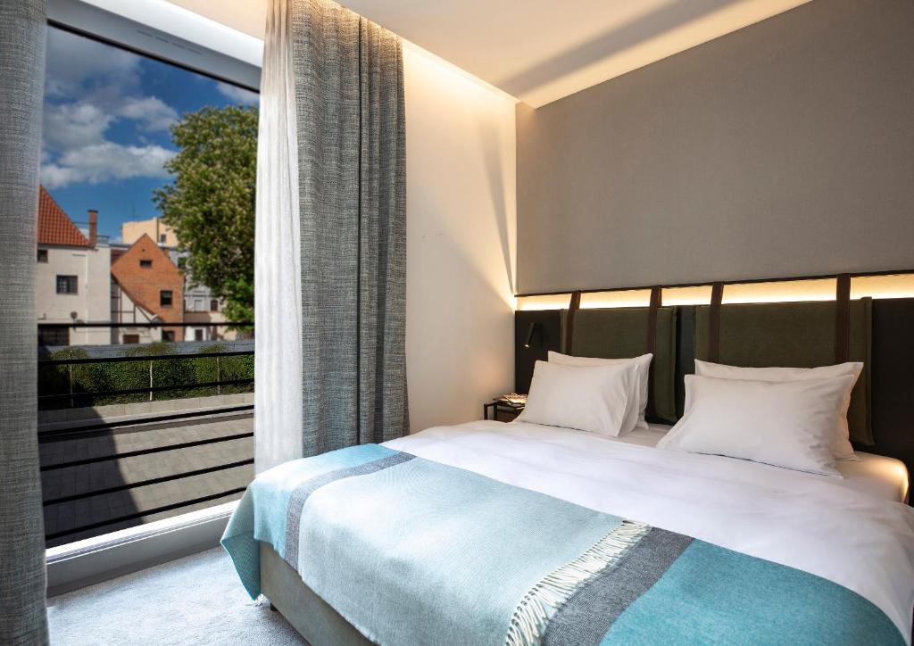 Postel nebo postele na pokoji v ubytování Hotel 1231