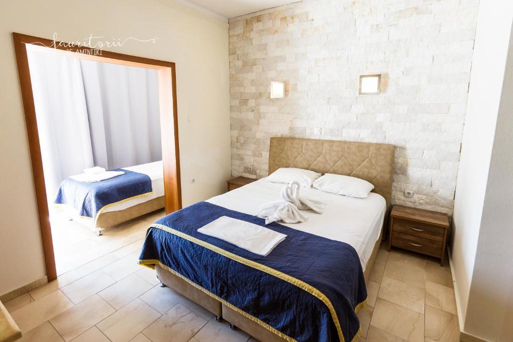 Postel nebo postele na pokoji v ubytování Kinira Beach Hotel