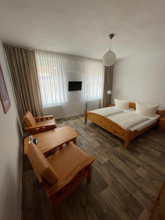 Postel nebo postele na pokoji v ubytování Hotel Garni „zum Bären“