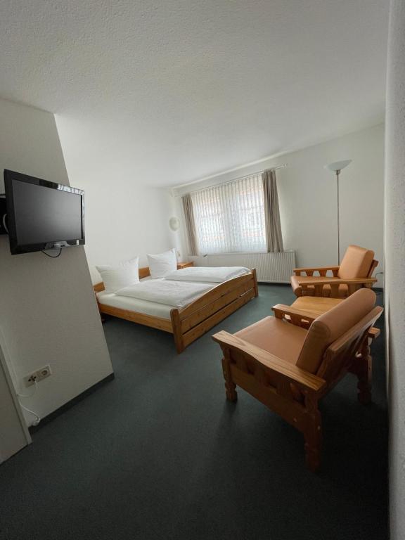 Postel nebo postele na pokoji v ubytování Hotel Garni „zum Bären“