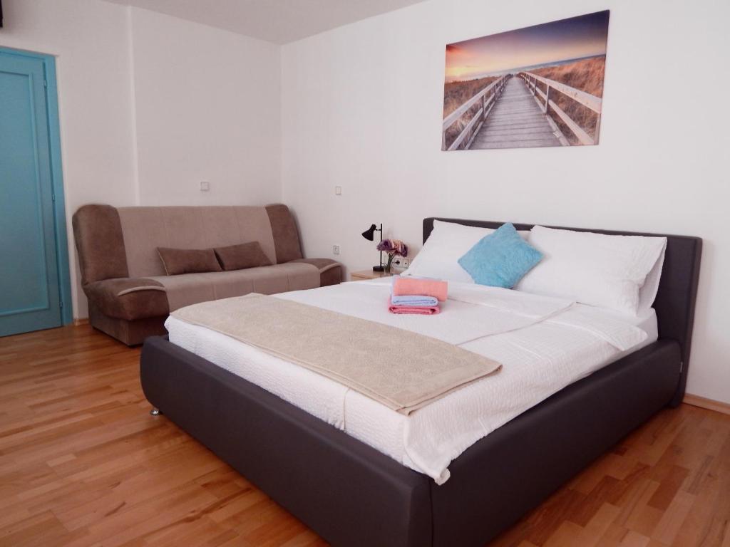 Postel nebo postele na pokoji v ubytování Apartments Igor